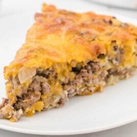 a slice of Cheeseburger Pie on a plate