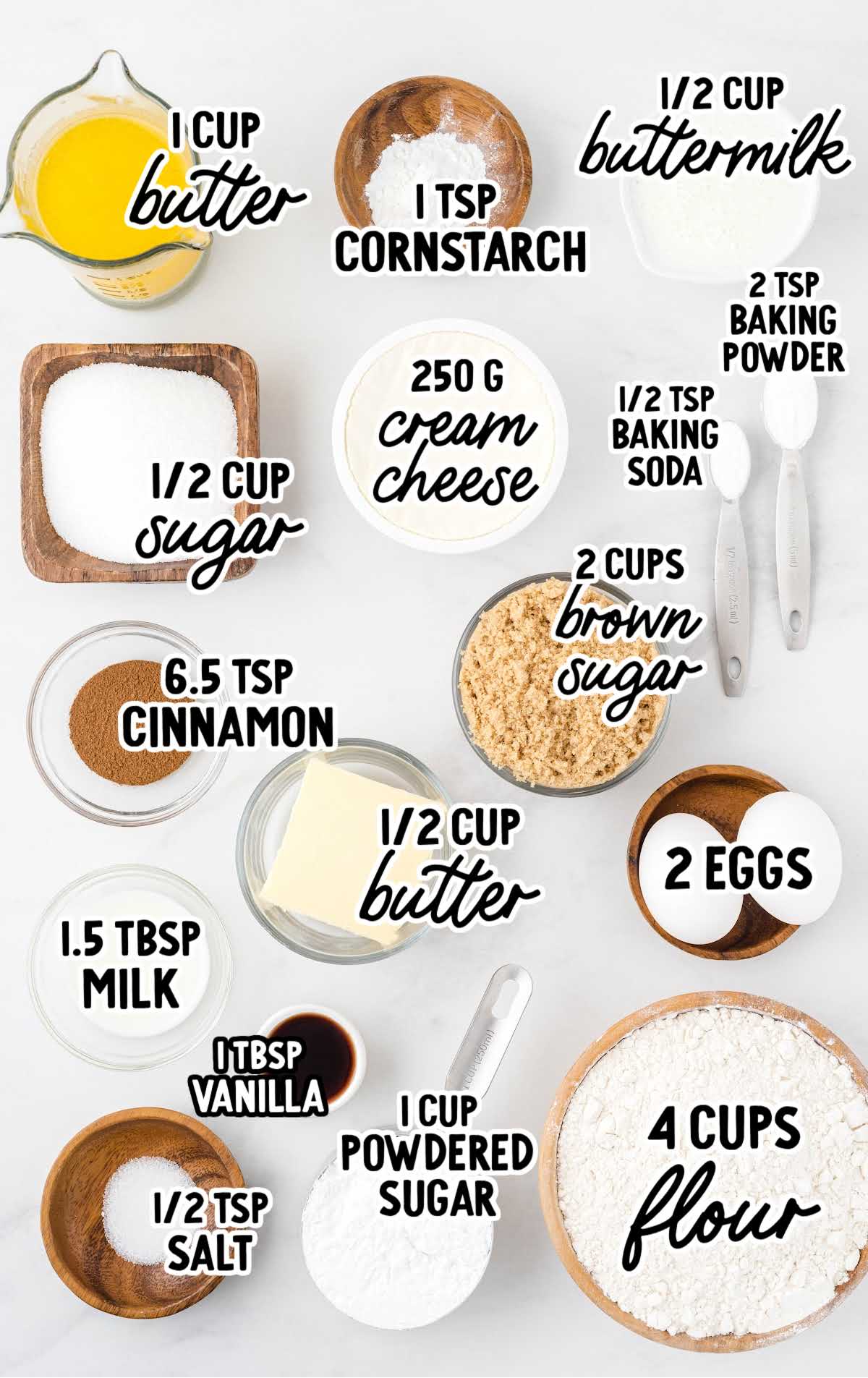 Overhead view of measured coffee cake ingredients including flour, sugar, butter, and cinnamon