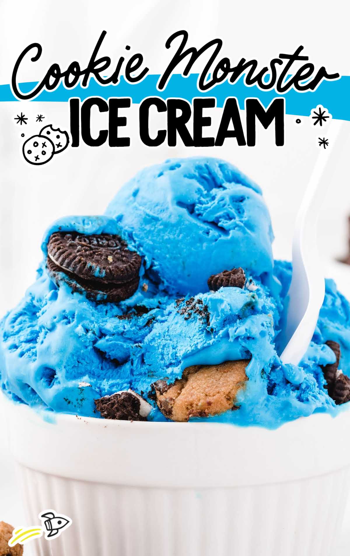 close up shot of scoops of Cookie Monster ice cream in a white bowl