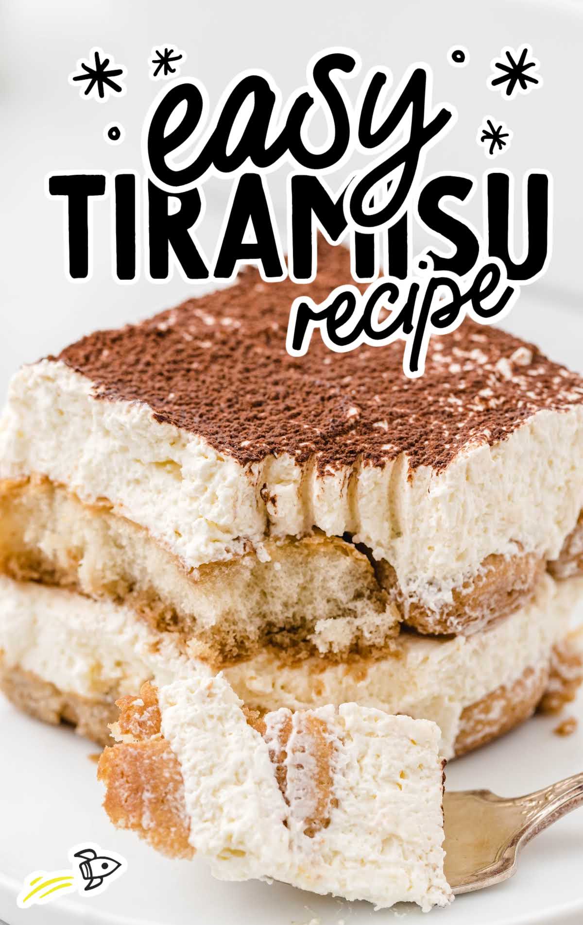 Front view of a generous piece of tiramisu showing layers of mascarpone and soaked ladyfingers