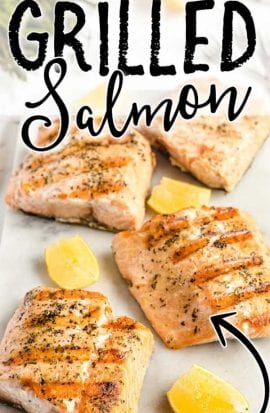 close up shot of slices of grilled salmon with slices of lemon