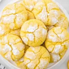 close up shot of lemon crinkle cookies in a bowl