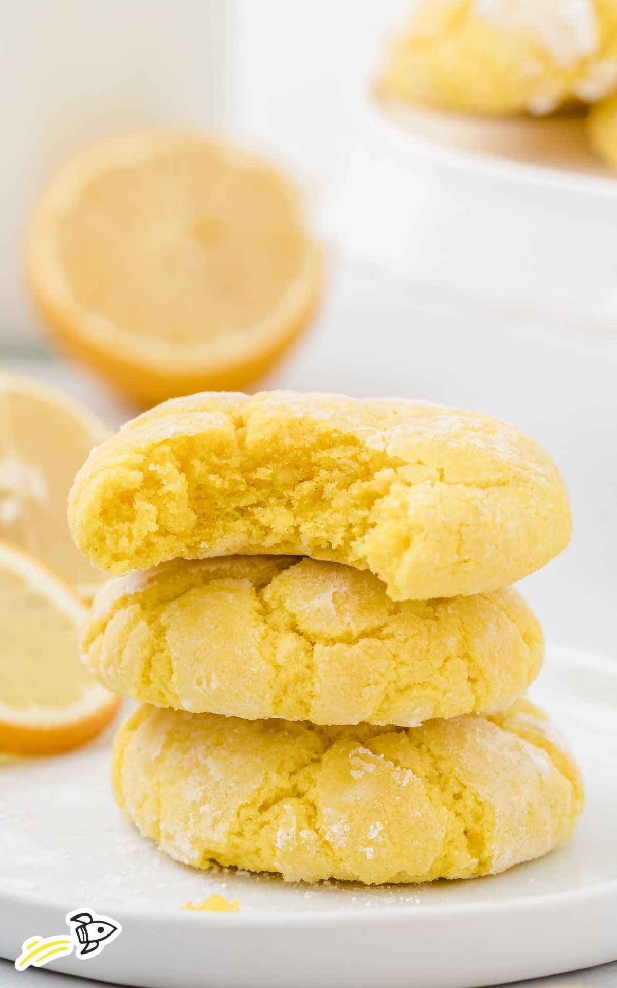 close up shot of lemon crinkle cookies stacked on top of each other