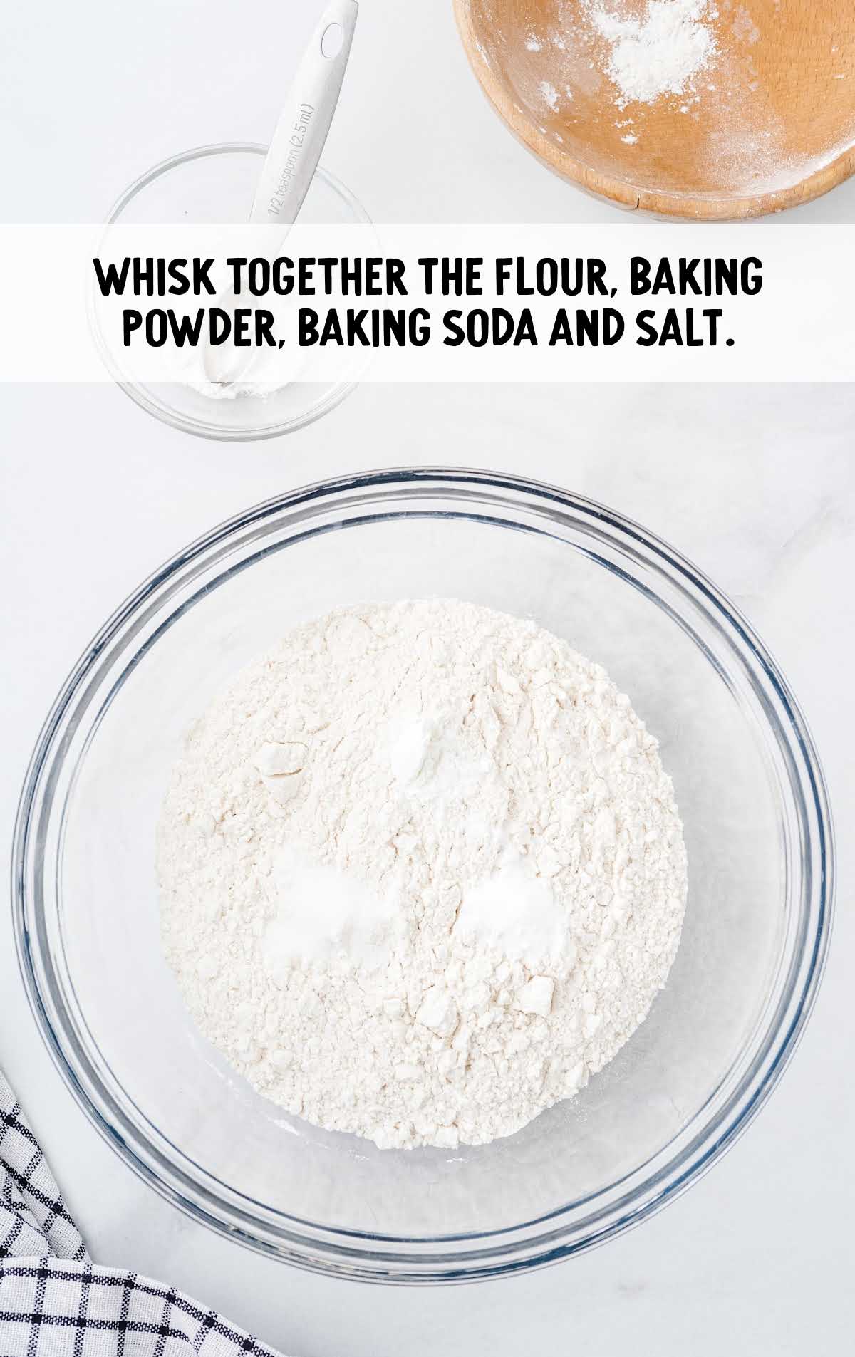 flour, baking powder, baking soda, and salt combined in a bowl