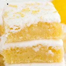 close up shot of Lemon Brownies stacked on top of each other
