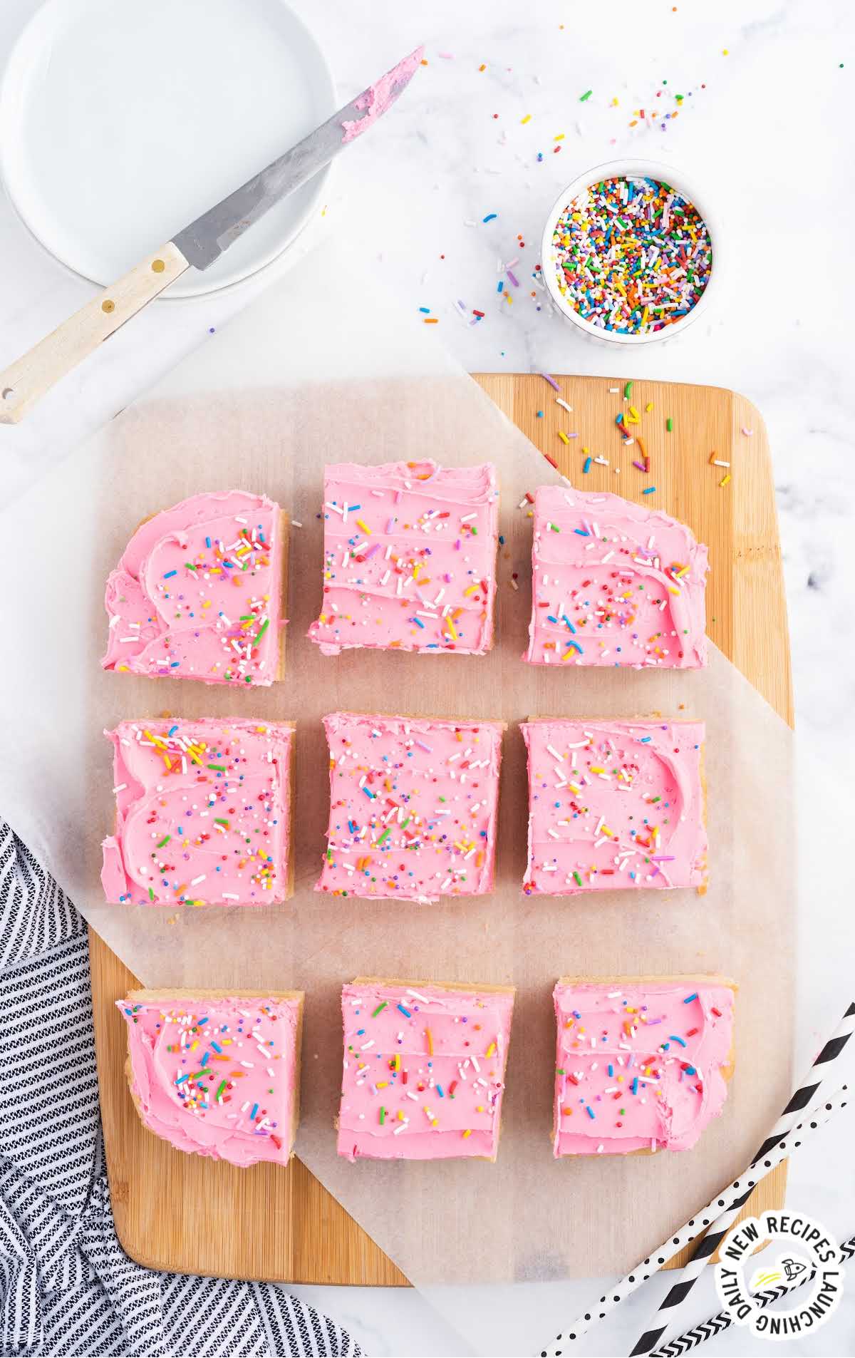 overhead shot of Sugar Cookie Bars on a wooden board