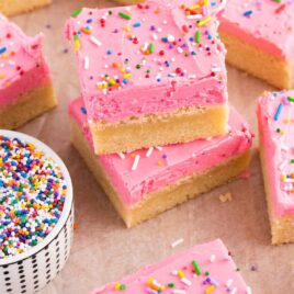 close up shot of Sugar Cookie Bars stacked on top of each other