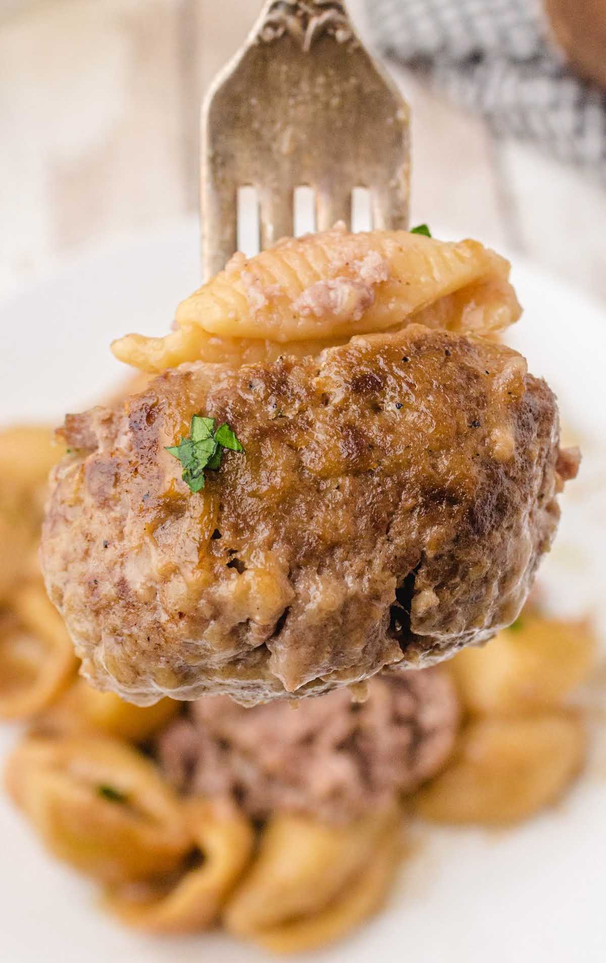 swedish meatballs and noodles on a fork
