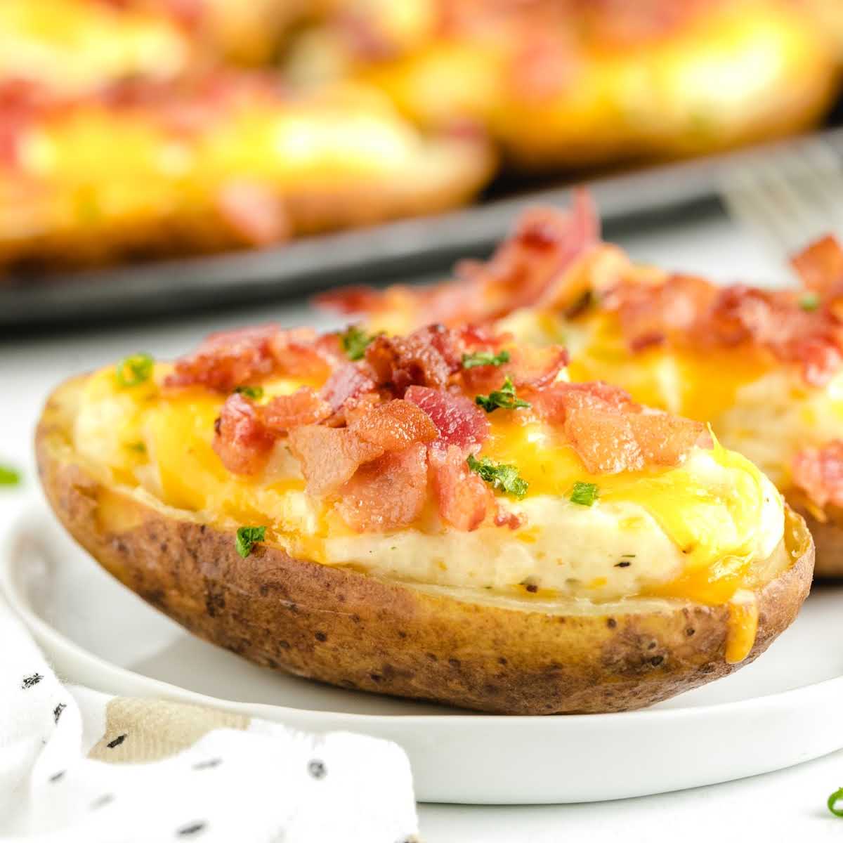 close up shot of baked potatoes garnished with chives on a plate