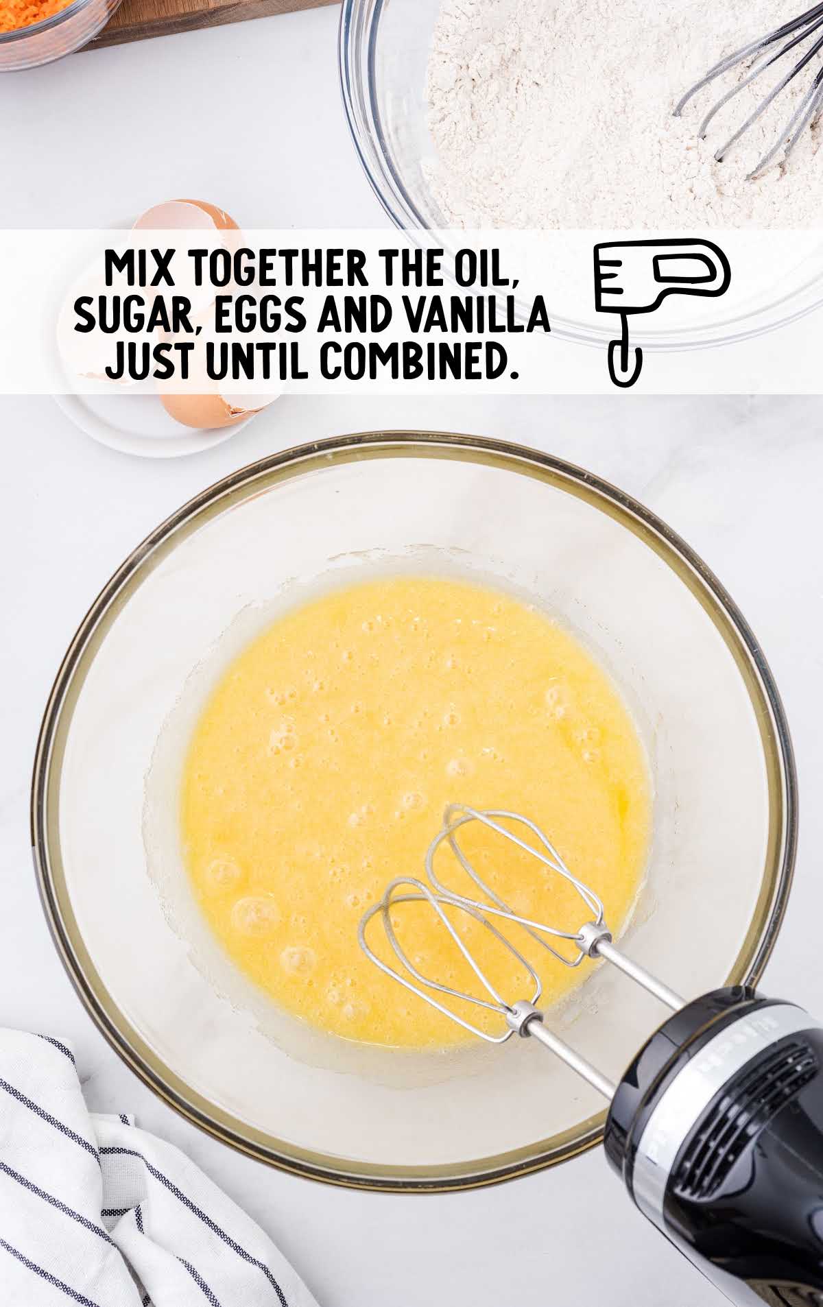 oil, sugar, eggs, and vanilla whisked together in a bowl