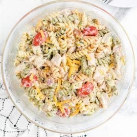 overhead close up shot of chicken bacon ranch pasta salad with ranch dressing in a bowl