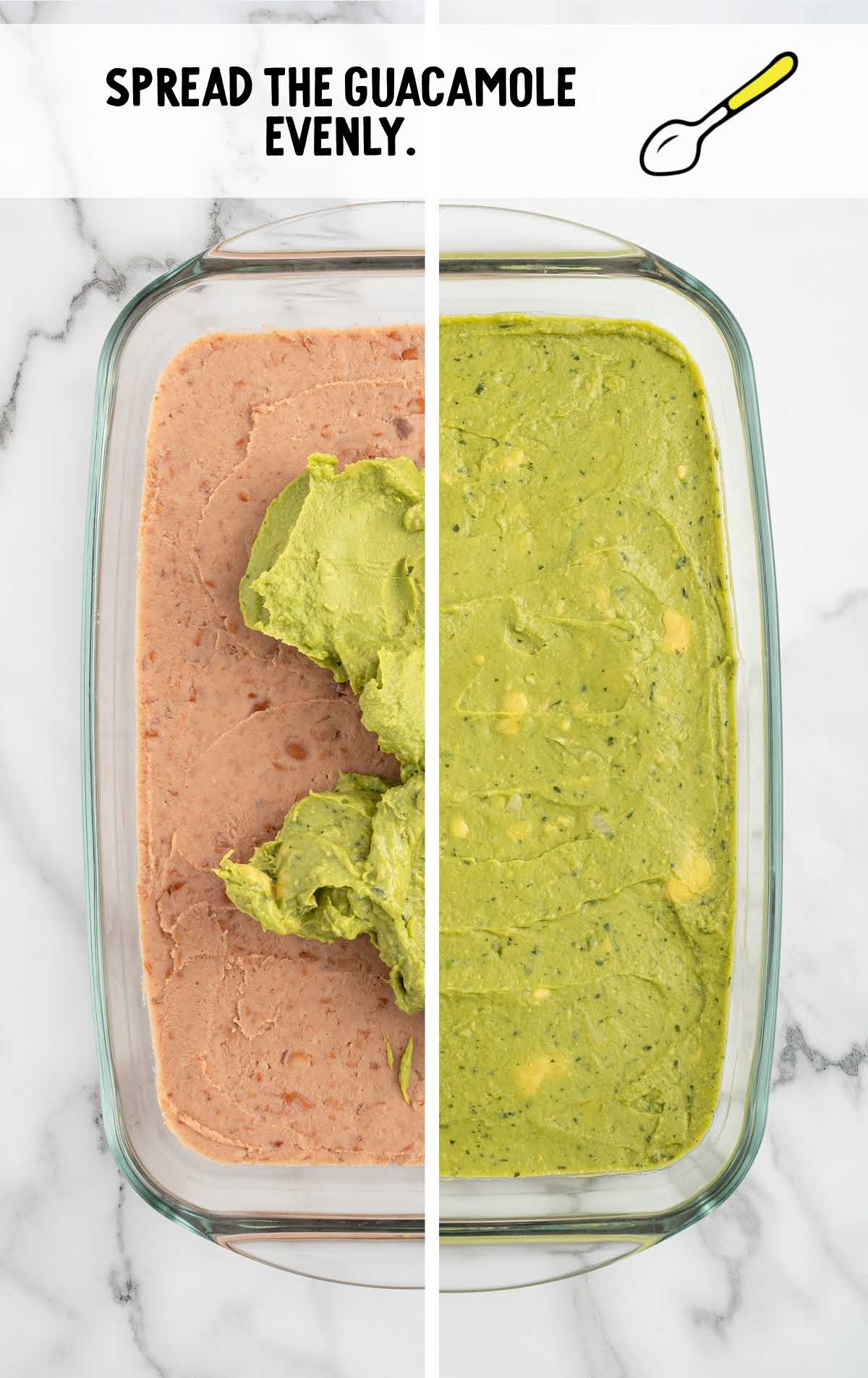 guacamole spread over the bean layer