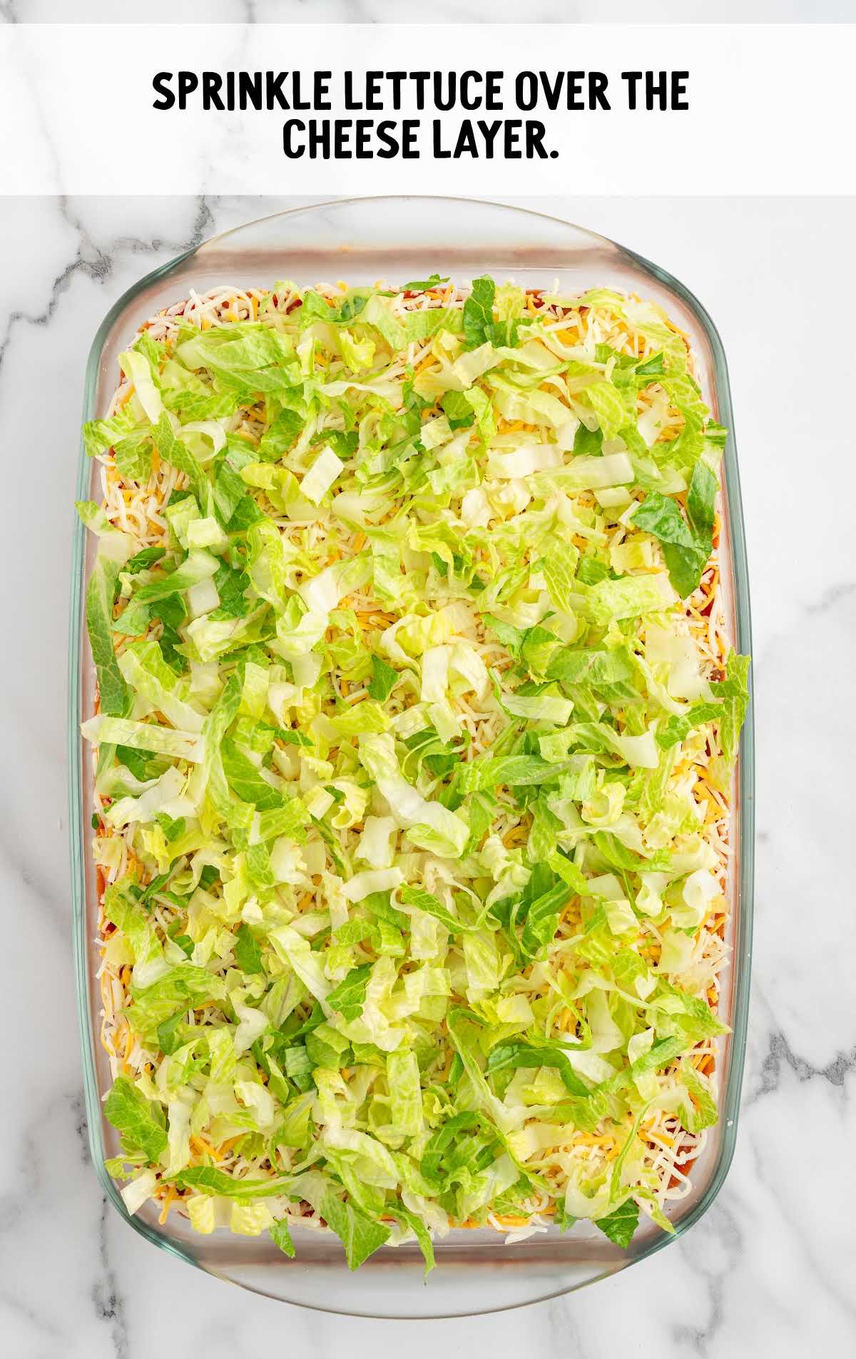 shredded lettuce sprinkled over the cheese layer