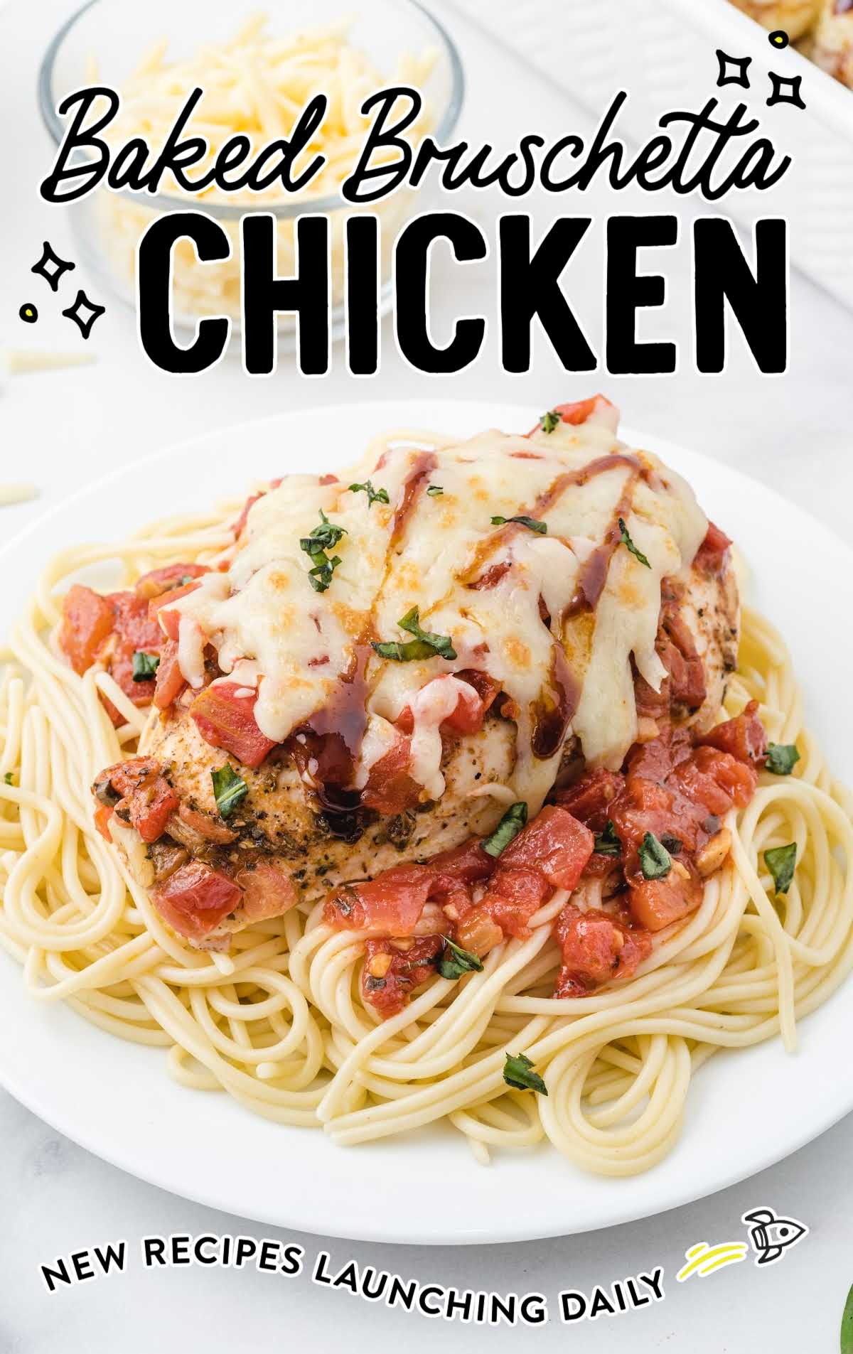 overhead shot of baked bruschetta chicken topped with mozzarella cheese then drizzled with balsamic glaze and basil served over pasta