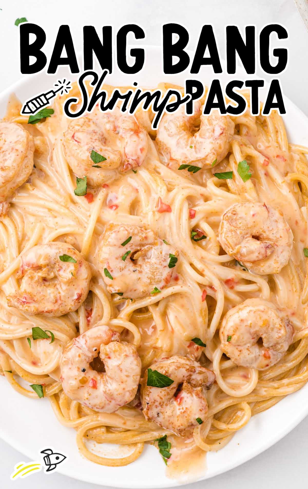 close up overhead shot of bang bang shrimp pasta on a white plate