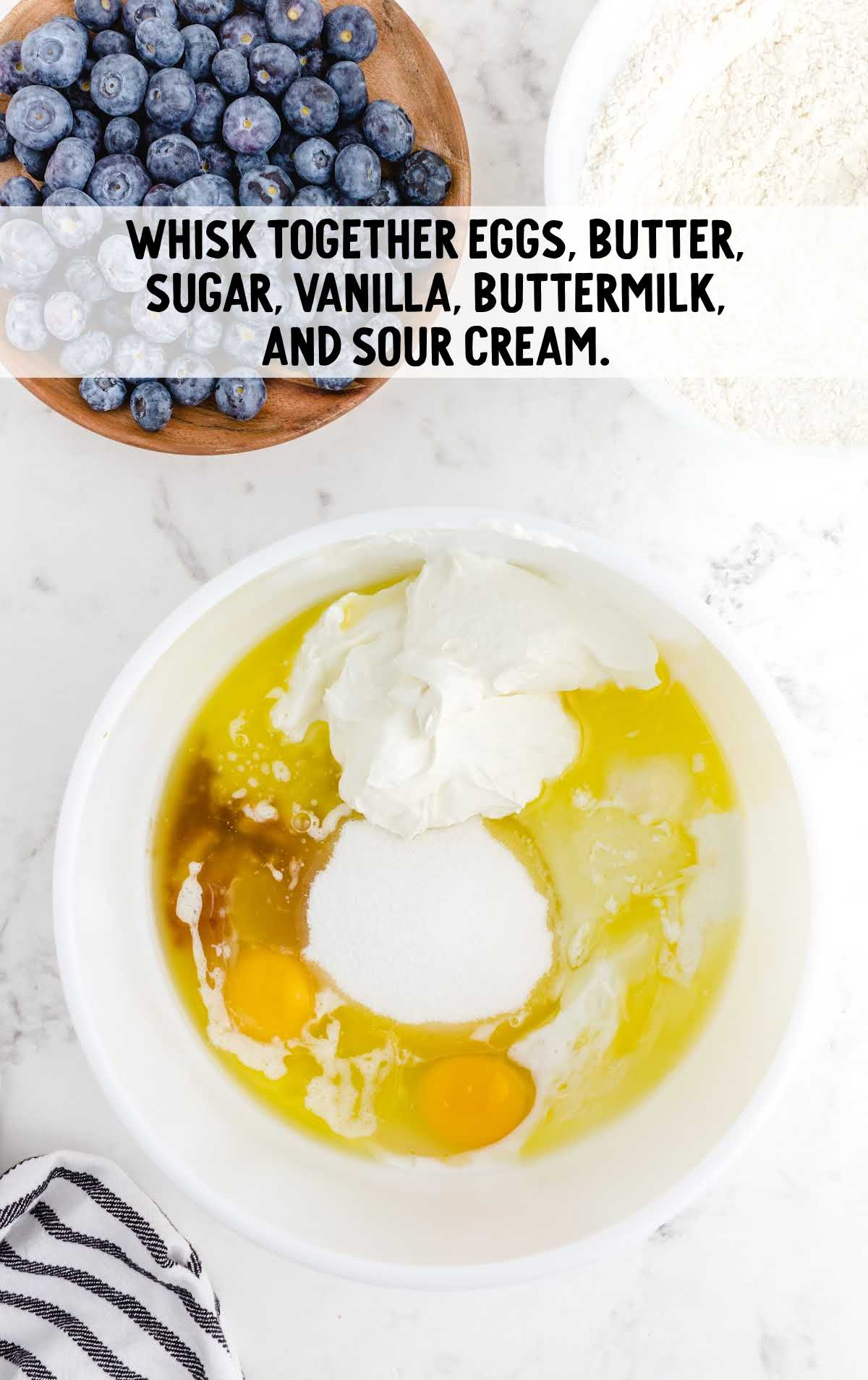 eggs, butter, sugar, vanilla, buttermilk, and sour cream whisked together