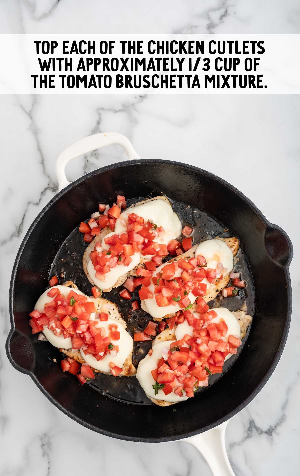 cold tomato bruschetta mixture spooned over the chicken pieces