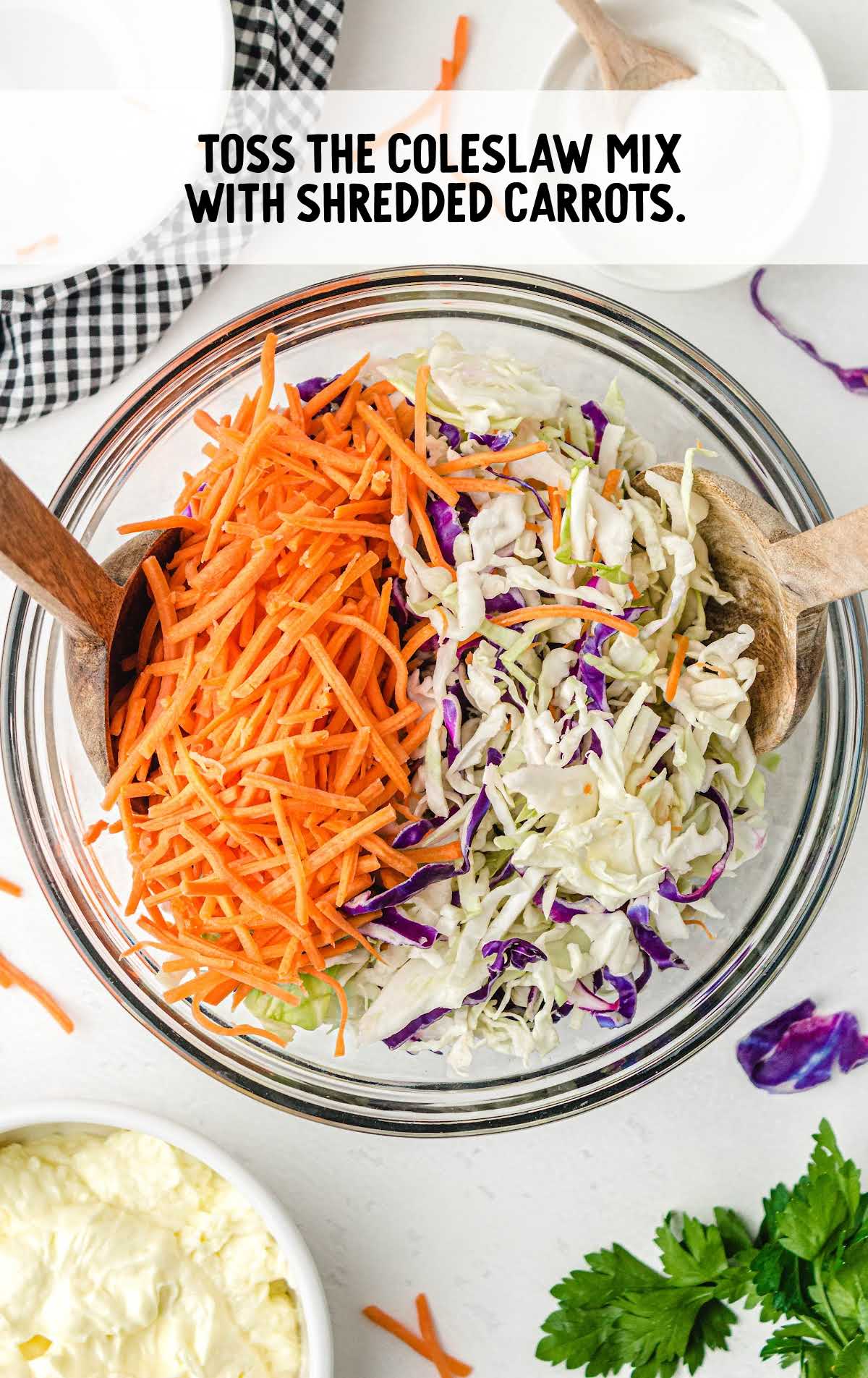 coleslaw mixture and carrots folded together in a bowl