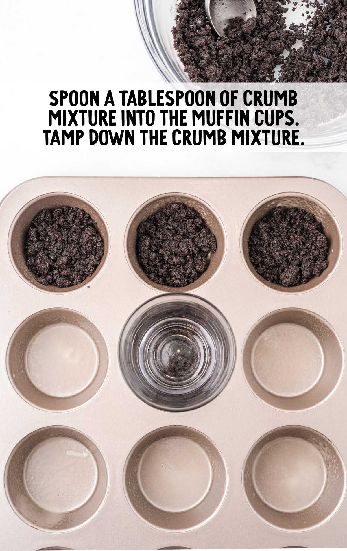 crumb mixture being spooned into muffin cups