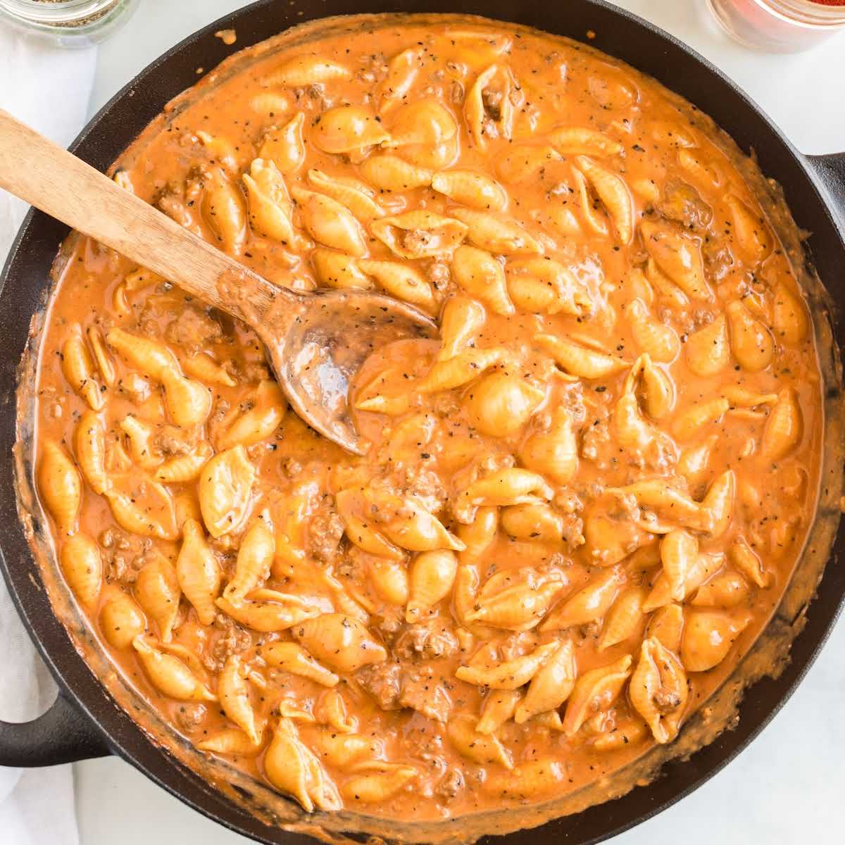 close up overhead shot of a skillet of Creamy Beef and Shells