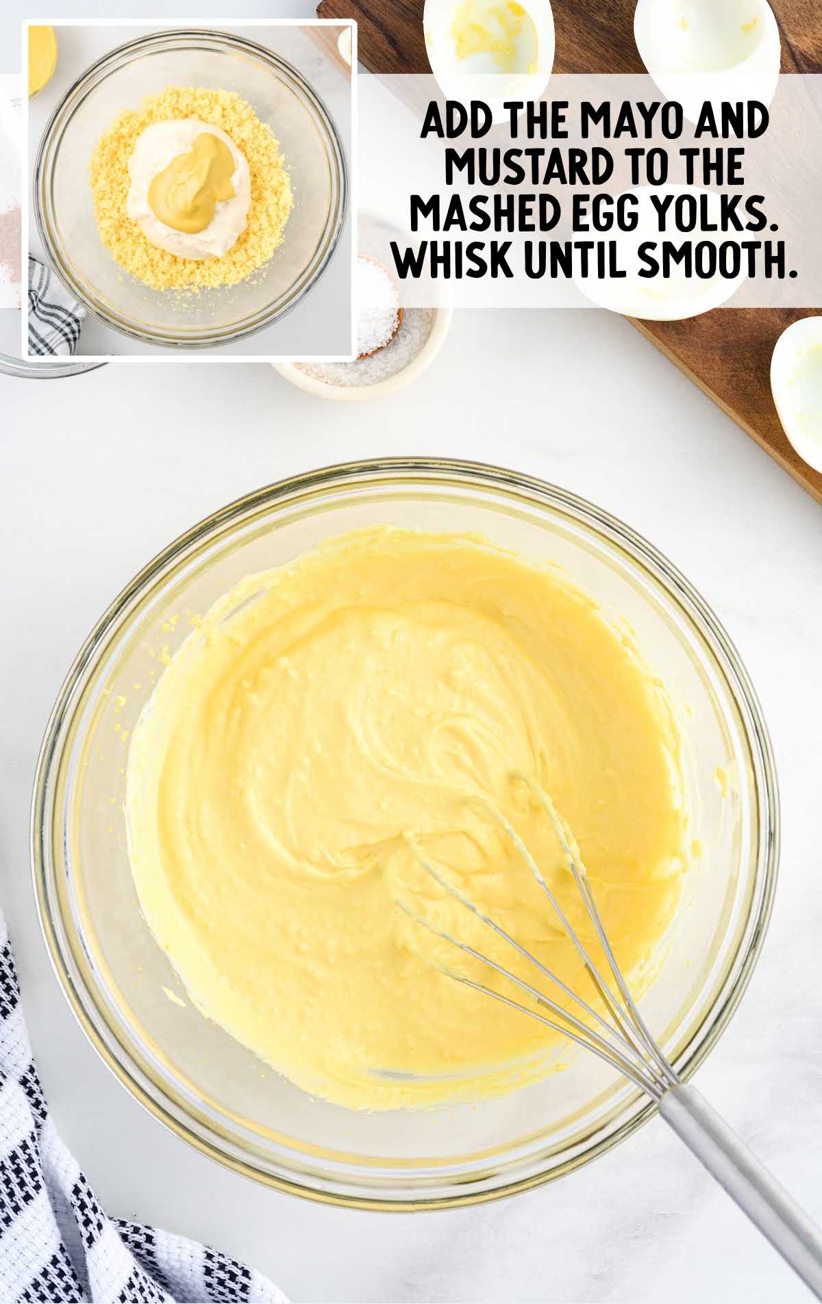 mayonnaise, yellow mustard, and mashed egg yolks whisked together in a bowl