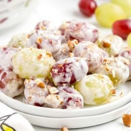 close up shot of a plate of Grape Salad garnished with chopped pecans