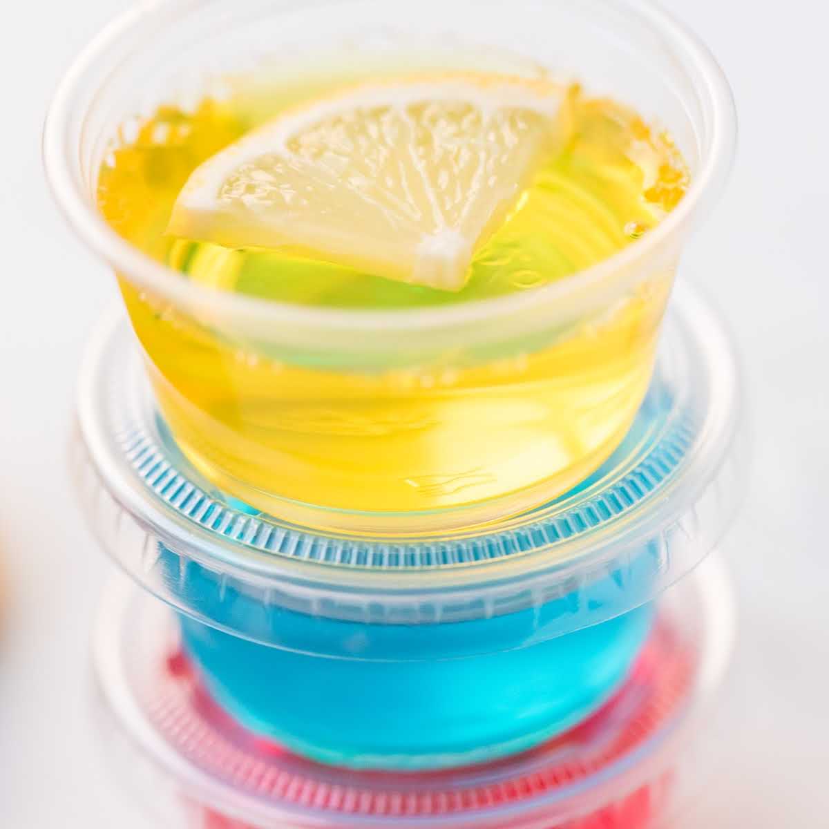 close up shot of plastic containers of Jello Shots stacked on top of each other