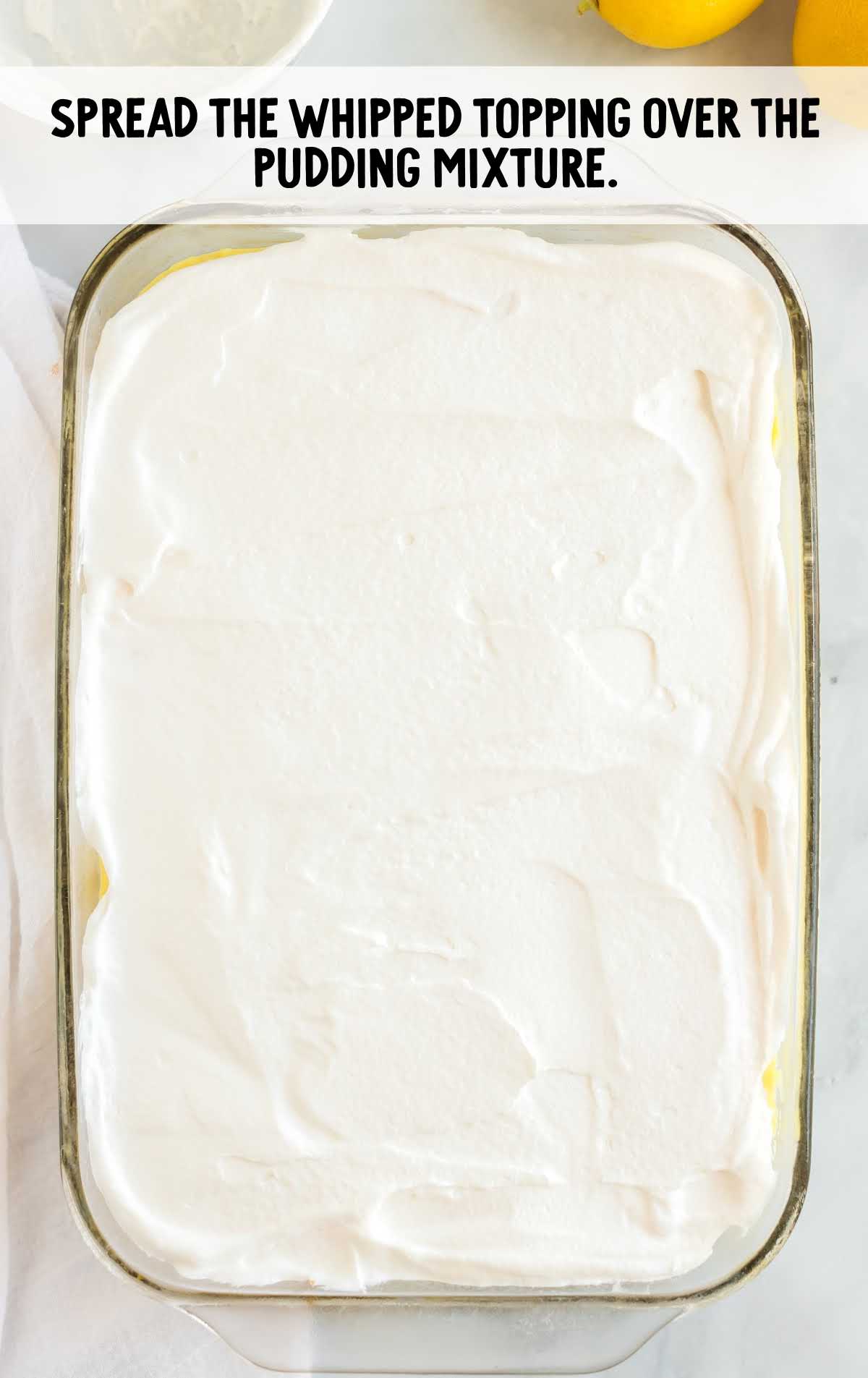 whipped topping spread over the pudding mixture