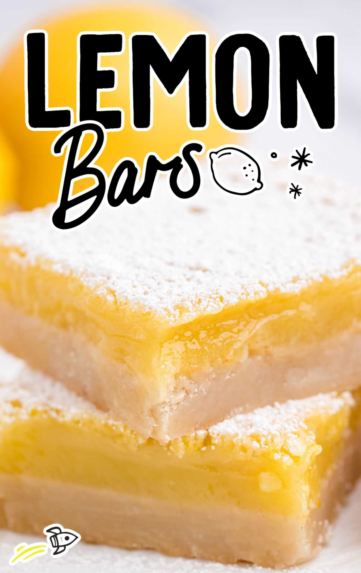 close up side shot of lemon bars stacked on top of each other
