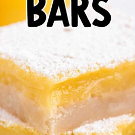 a close up shot of Lemon Bars stacked on top of each other