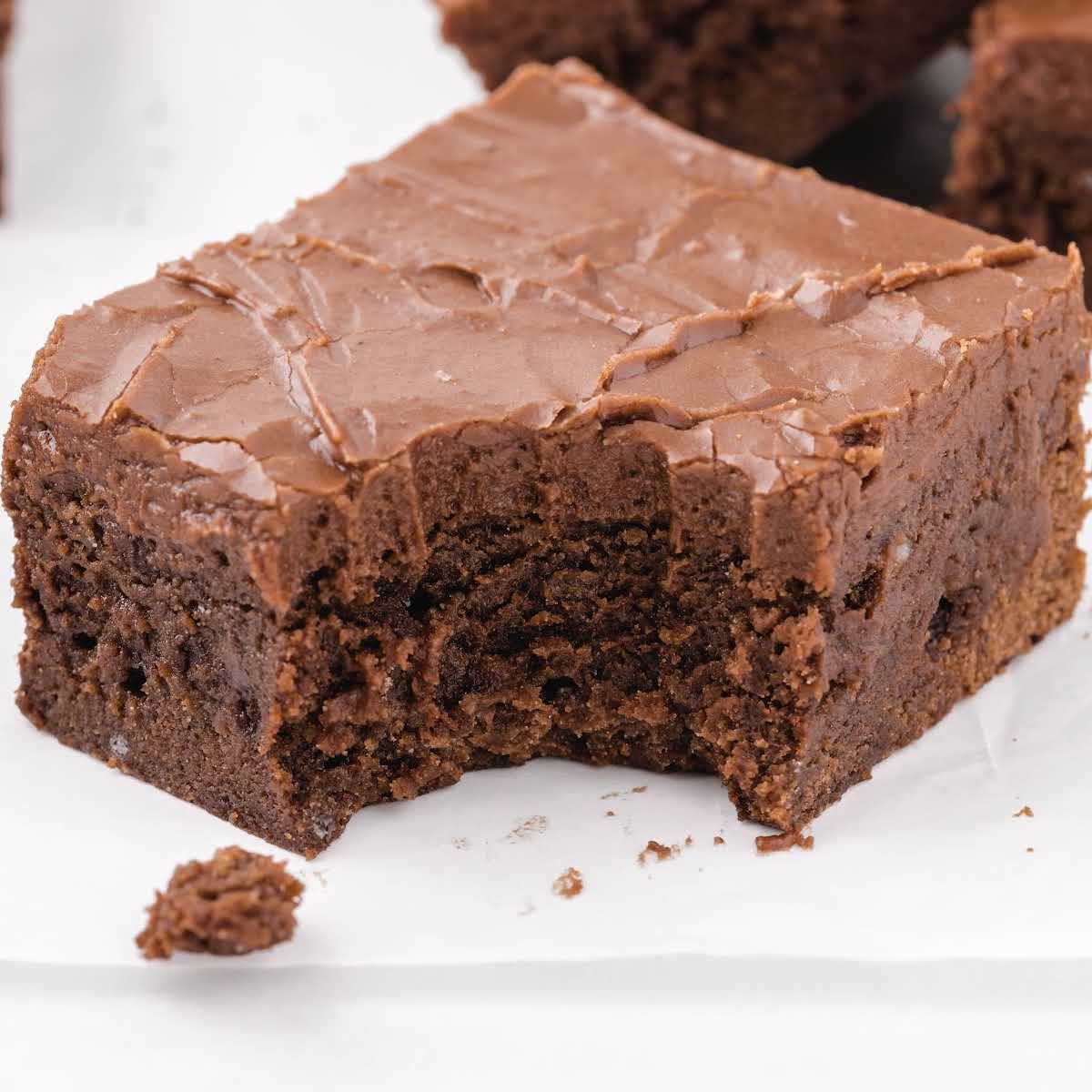close up shot of Lunch Lady Brownies with a bite taken out of it