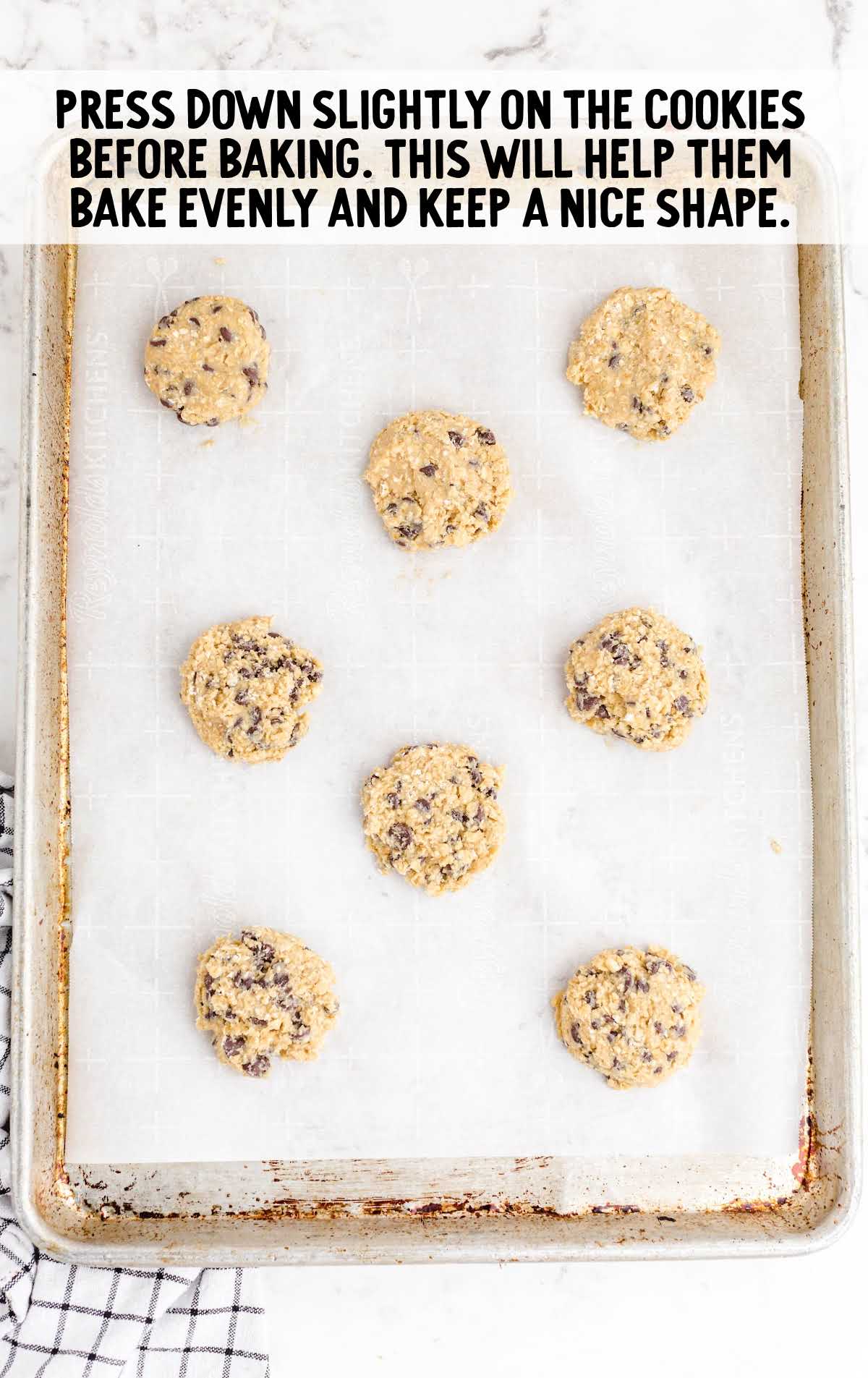 press down on the Oatmeal Chocolate Chip Cookies before baking