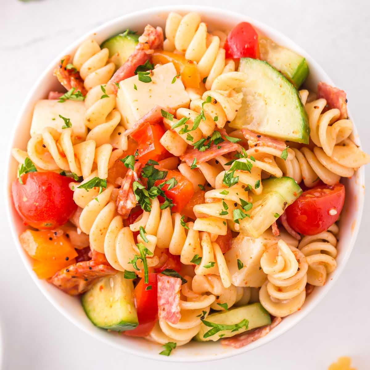 a bowl of Pasta Salad garnished with parsley