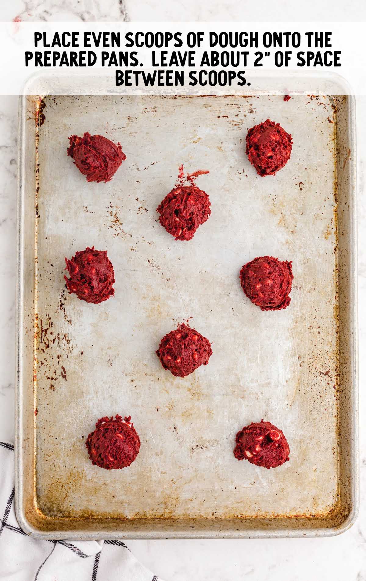 red velvet cookies process shot of scoops of cookie dough placed on a baking pan