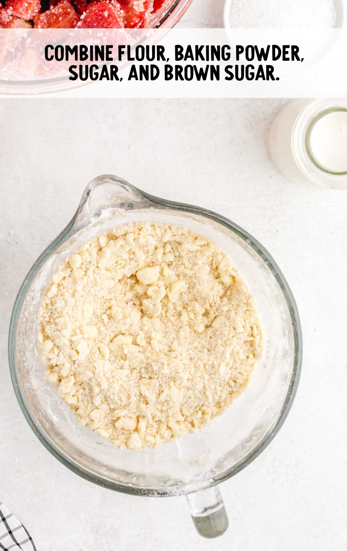 flour, baking powder, granulated sugar, and brown sugar placed in a measuring cup