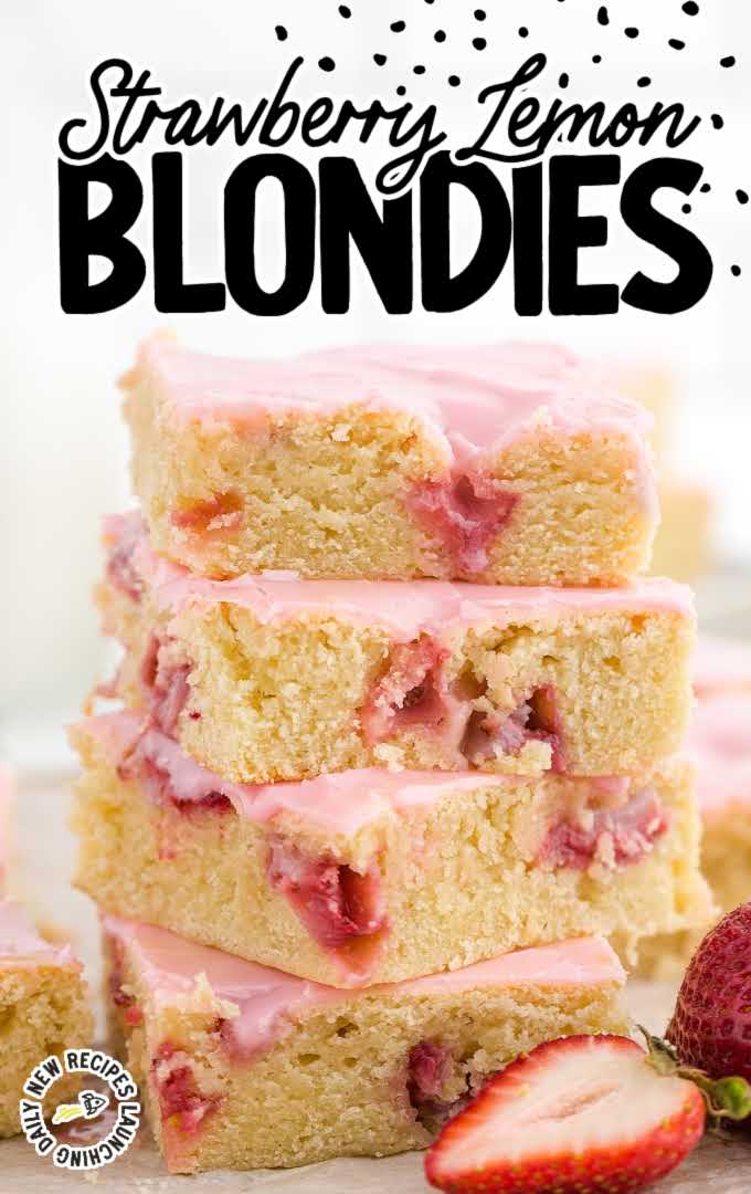 close up shot of strawberry lemon blondies with strawberry glaze stacked on top of each other