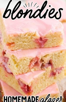 close up shot of strawberry lemon blondies with strawberry glaze stacked on top of each other