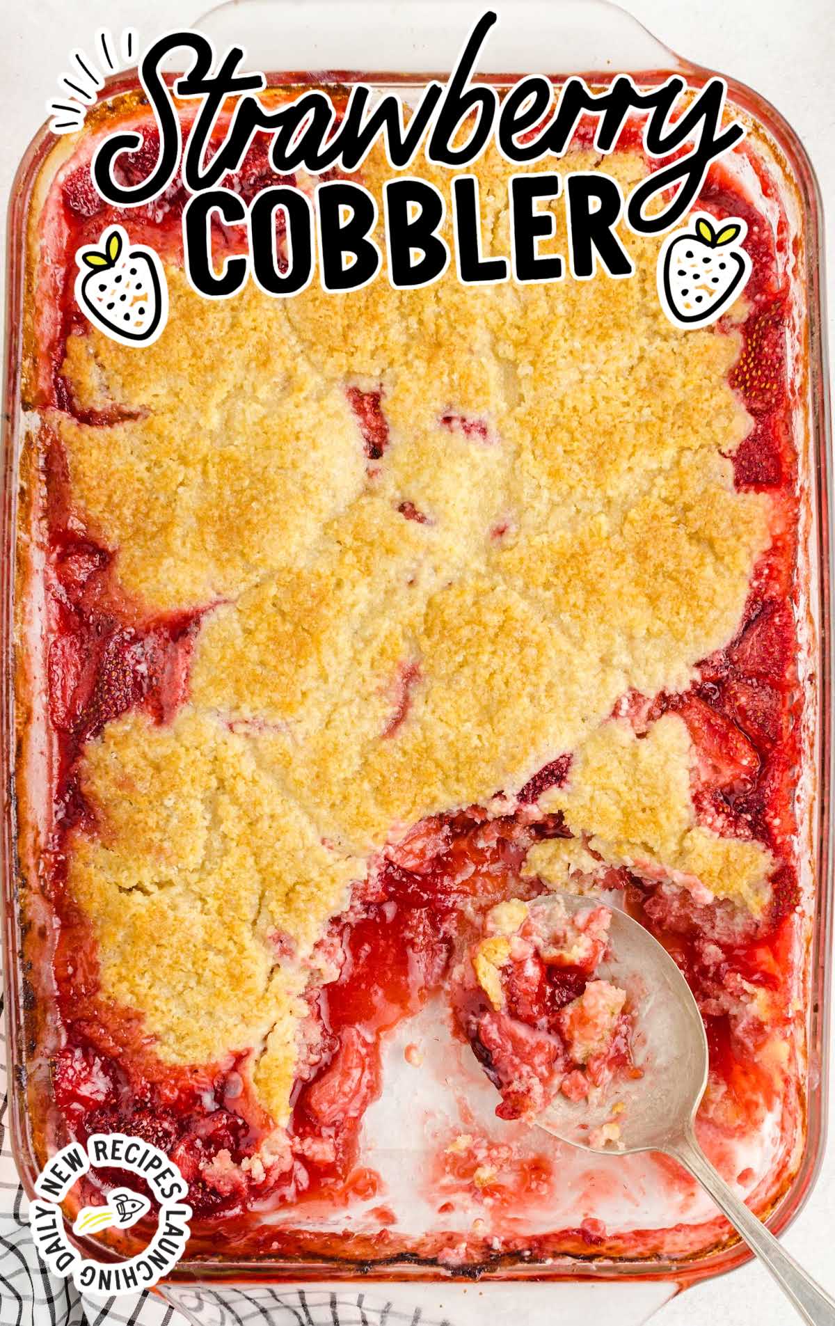 close up overhead shot of strawberry cobbler in a clear dish