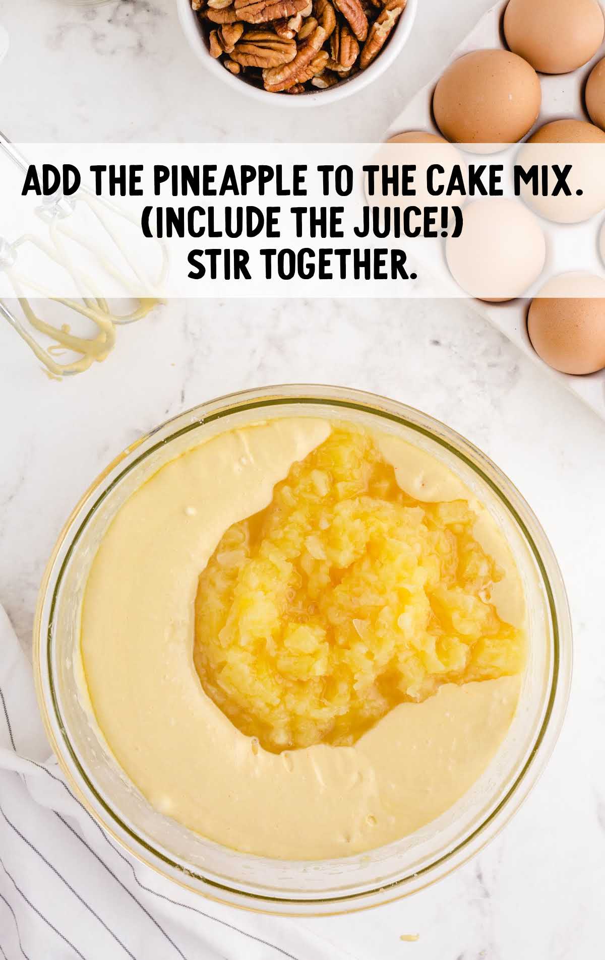 crushed pineapples added to the cake mix in a bowl