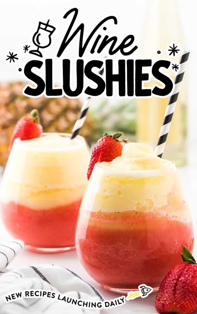 close up shot of wine slushies in a cocktail glasses with strawberries and a straws