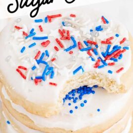 sugar cookies topped with frosting and 4th of July sprinkles
