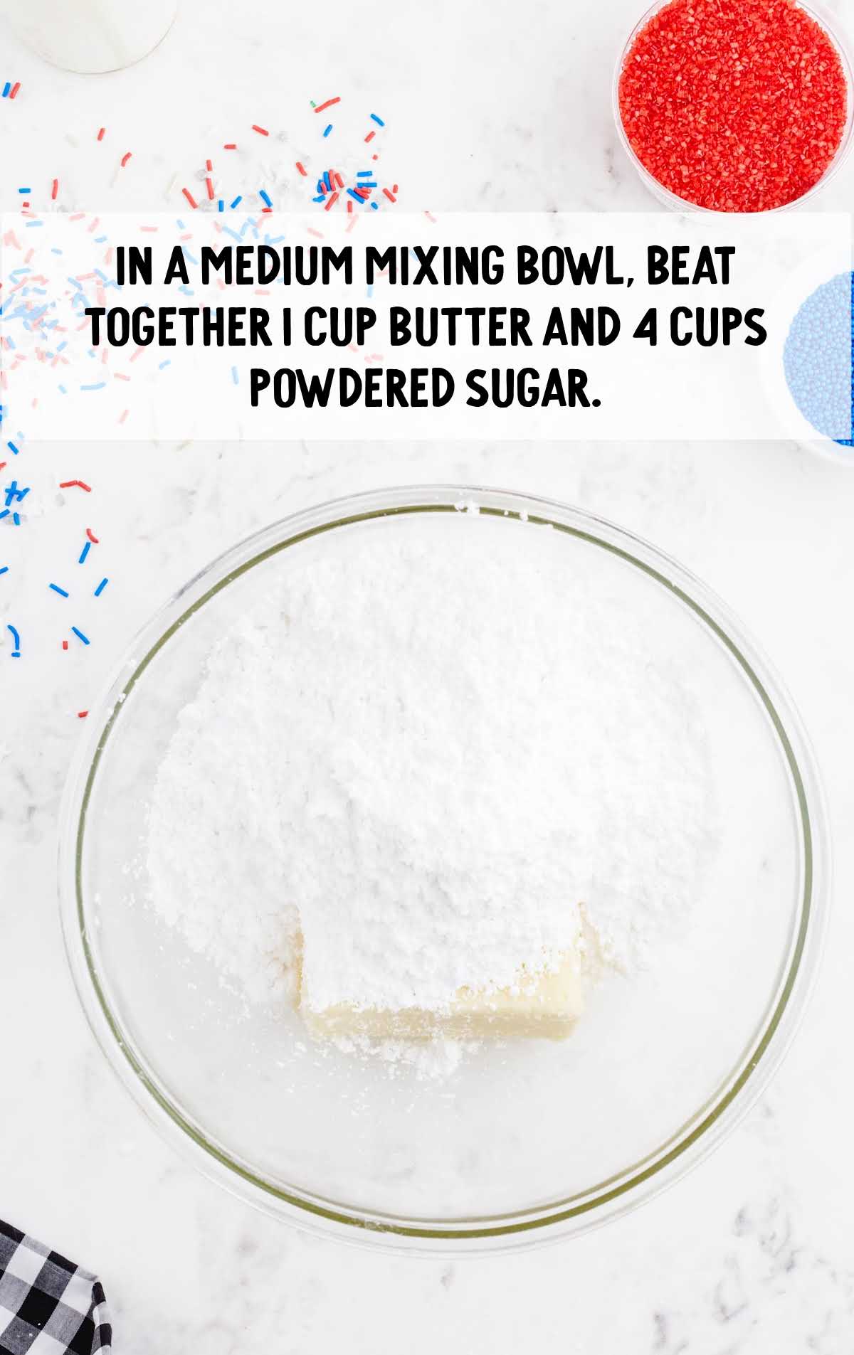 butter and powdered sugar mixed together in a bowl