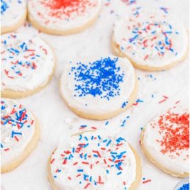 close up shot of 4th of July sugar cookies topped with frosting and sprinkles