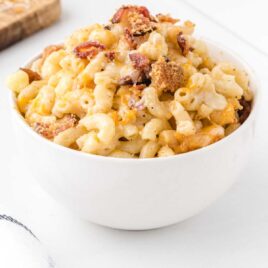 close up shot of bacon mac and cheese in a bowl