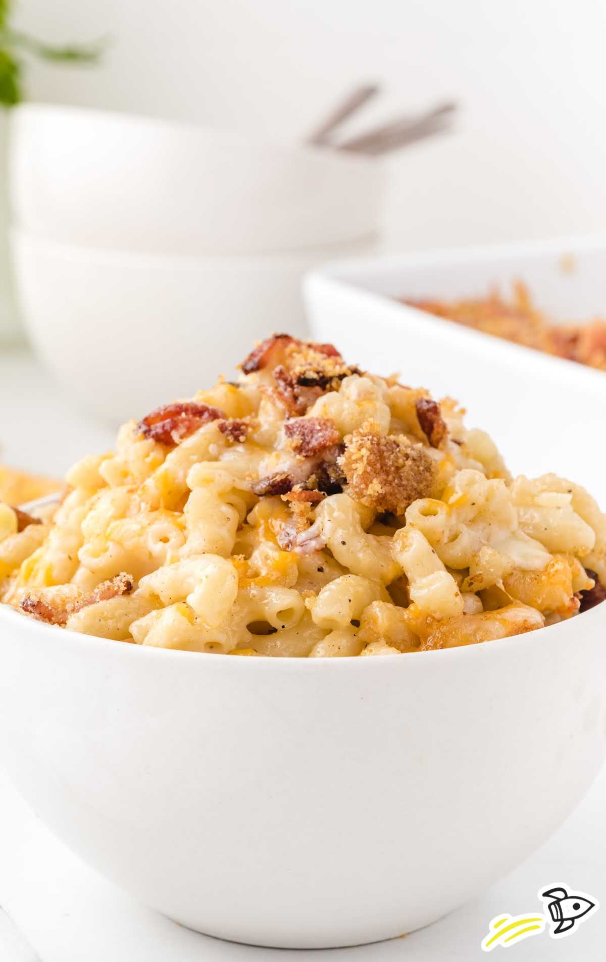 close up shot of bacon mac and cheese in a bowl
