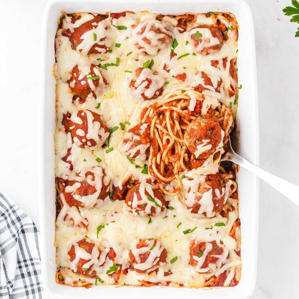 overhead shot of Baked Spaghetti and Meatballs in a baking dish