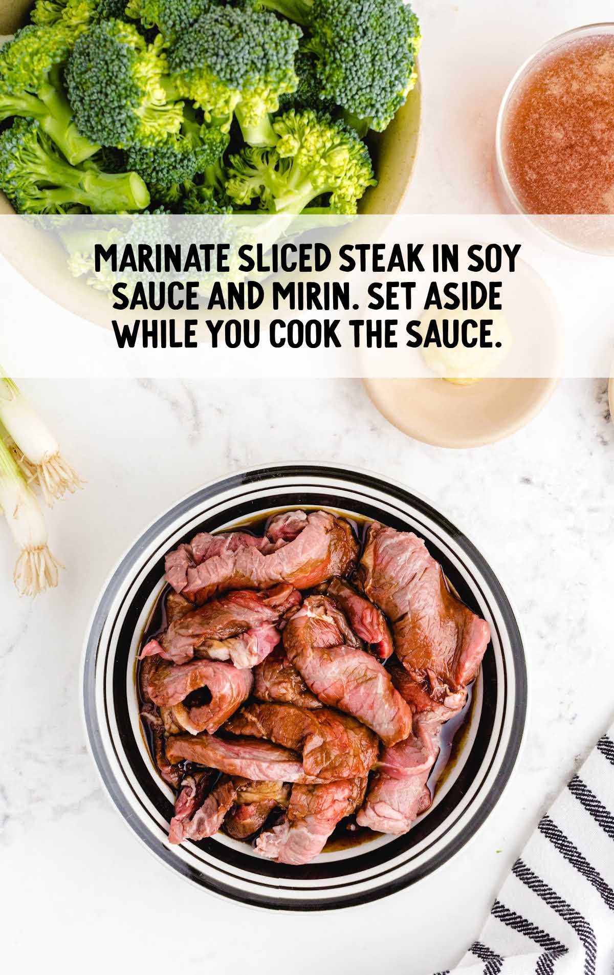 steak being marinated in a bowl