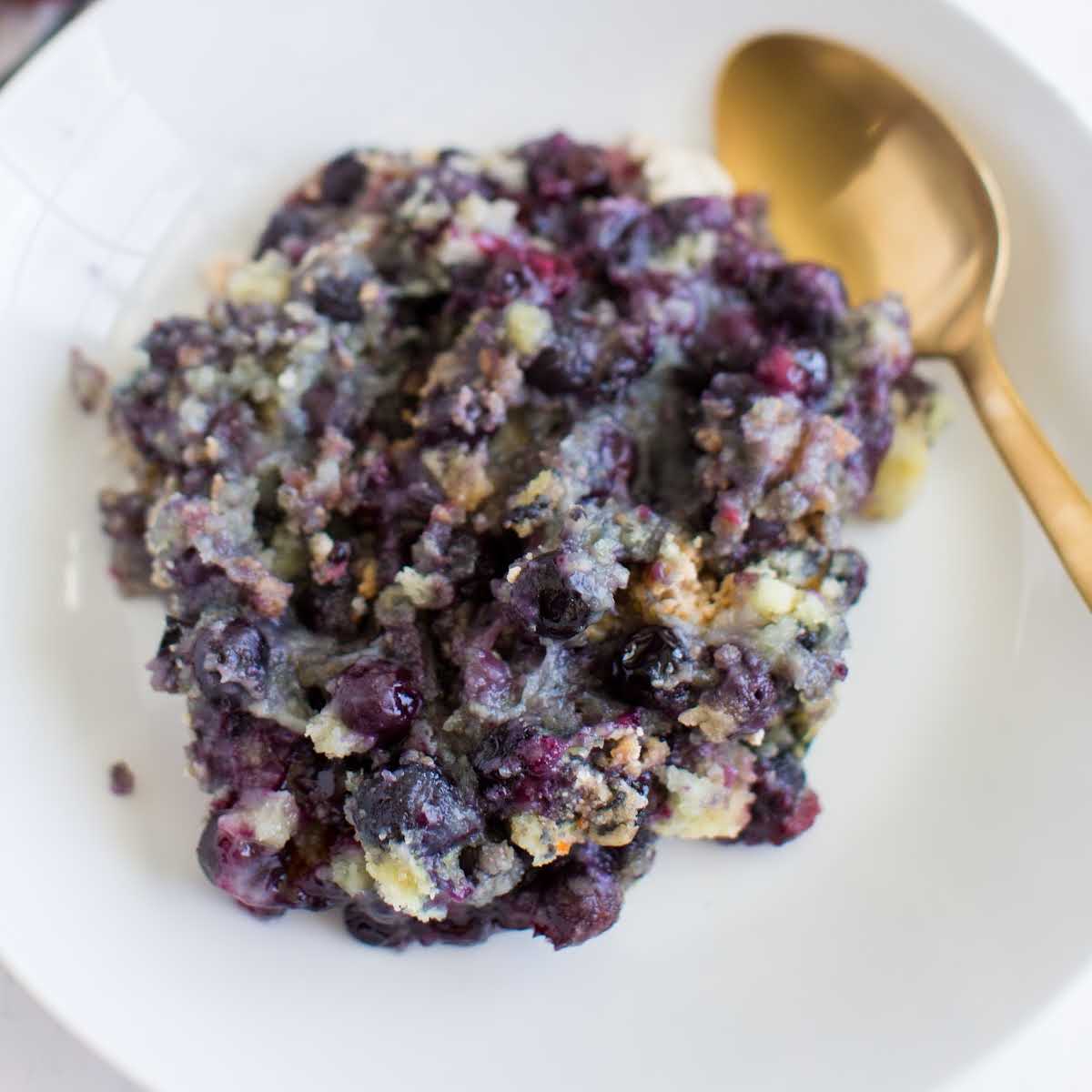 close up overhead shot of Blueberry Cobbler Recipe on a plate with a spoon