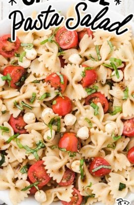 close up overhead shot of Caprese pasta salad topped with basil in a bowl
