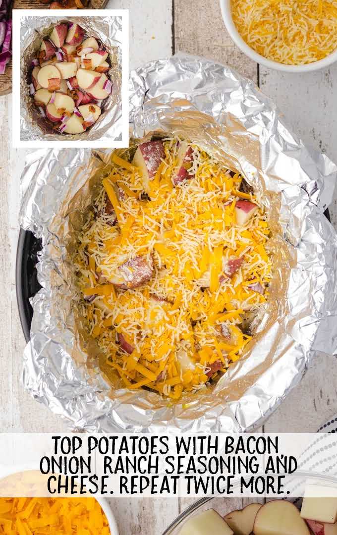 potatoes topped with cheese in a crock pot